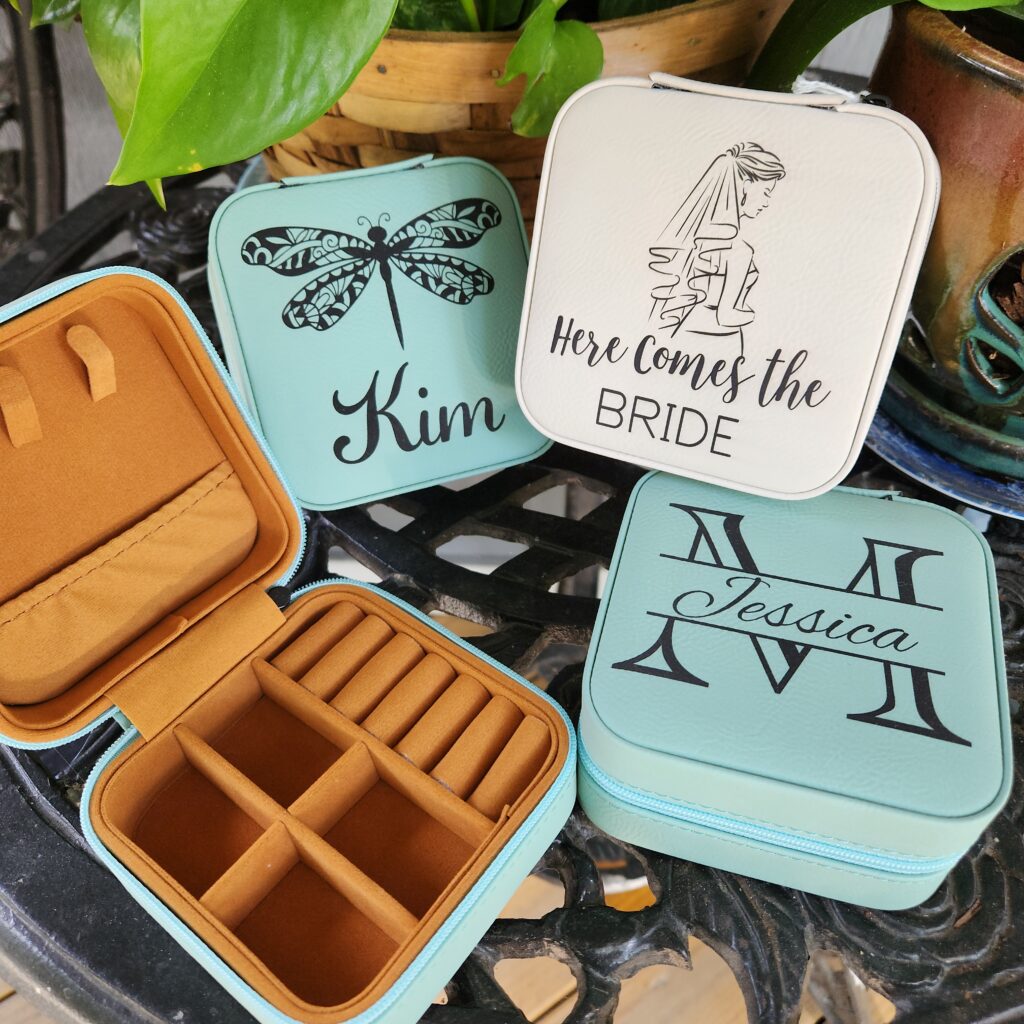 Bridal party gifts of leatherette jewelry boxes with custom wedding engravings