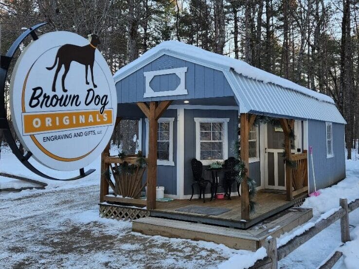 The Brown Dog Originals shop with contact & hours posted