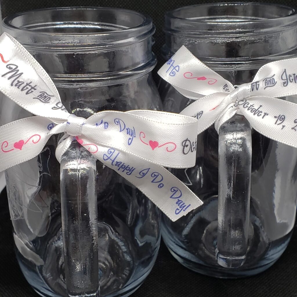glassware with personalized custom wedding engraving and personalized ribbon.